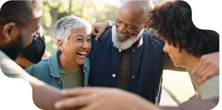 group of adults huddling and smiling