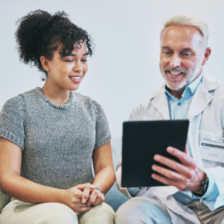 Doctor, patient and man with tablet for consultation
